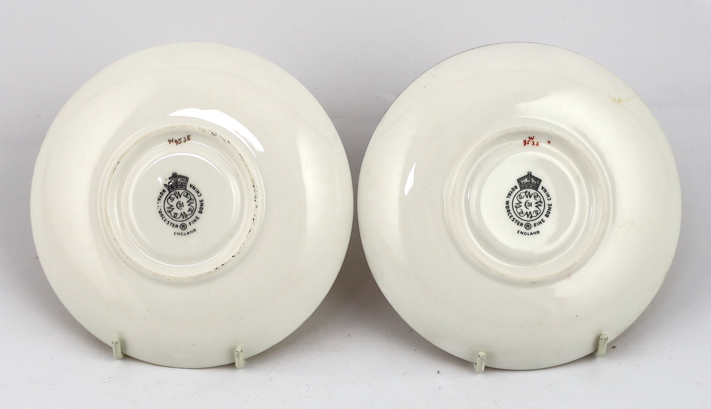 A pair of Royal Worcester fruit painted tea cups and saucers, 1960s